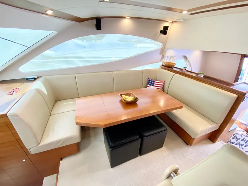 Slide: The Image of Luxurious interior of 2014 Dyna 52 yacht with elegant seating and wooden table. - 36