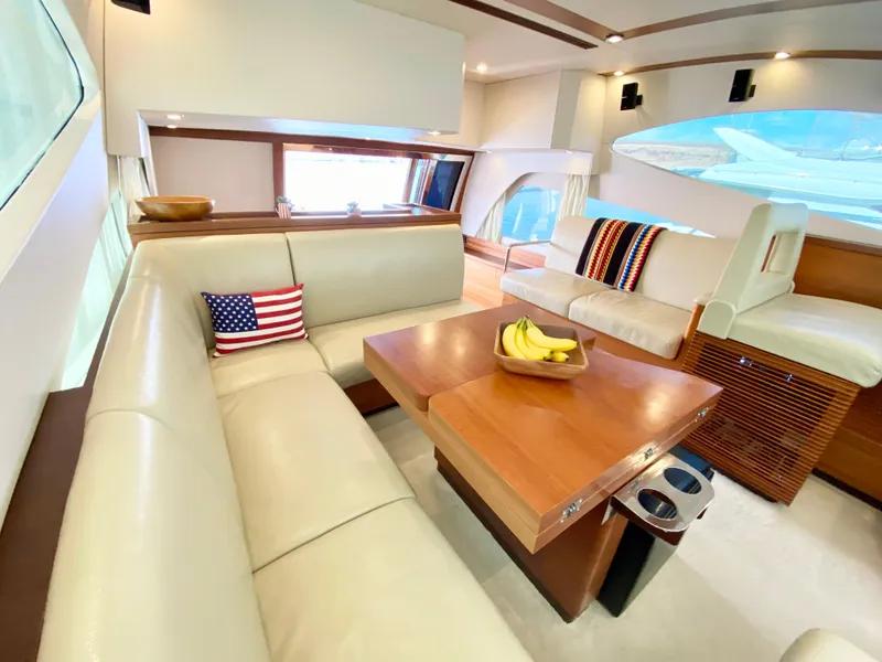 Slide: The Image of Luxurious interior of 2014 Dyna 52 yacht with plush seating and wooden table. - 38