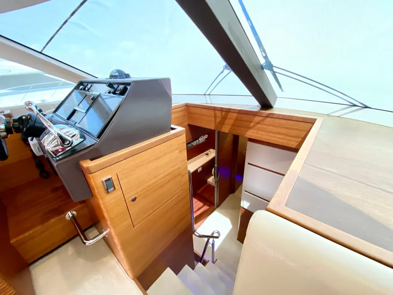 Slide: The Image of Interior of 2014 Dyna 52 yacht with modern helm and wooden finishes. - 39