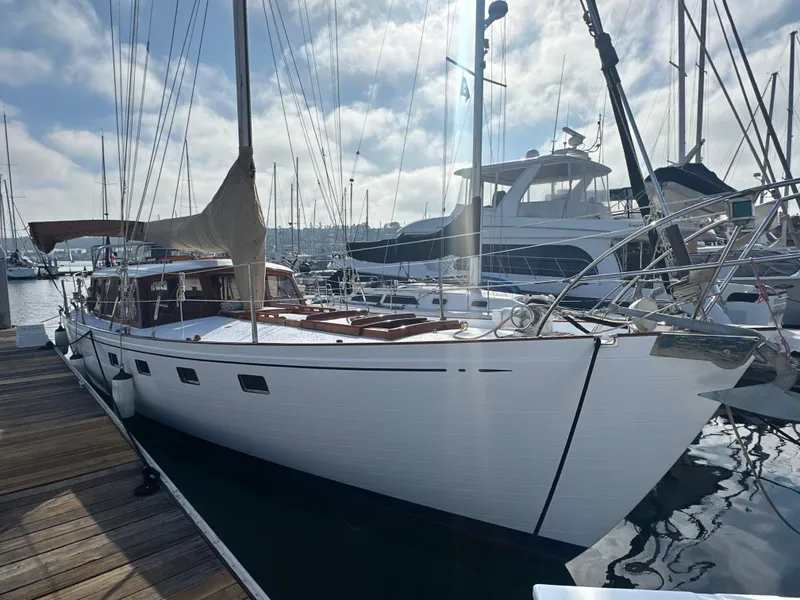 Slide: The Image of Interior of a 1969 Calkins 50 Pilot House with wooden furnishings and seating. - 1