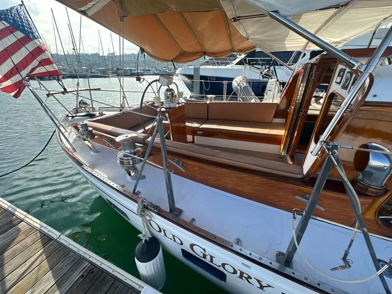 Slide: The Image of 1969 Calkins 50 Pilot House yacht with wooden interior, docked at marina. - 5