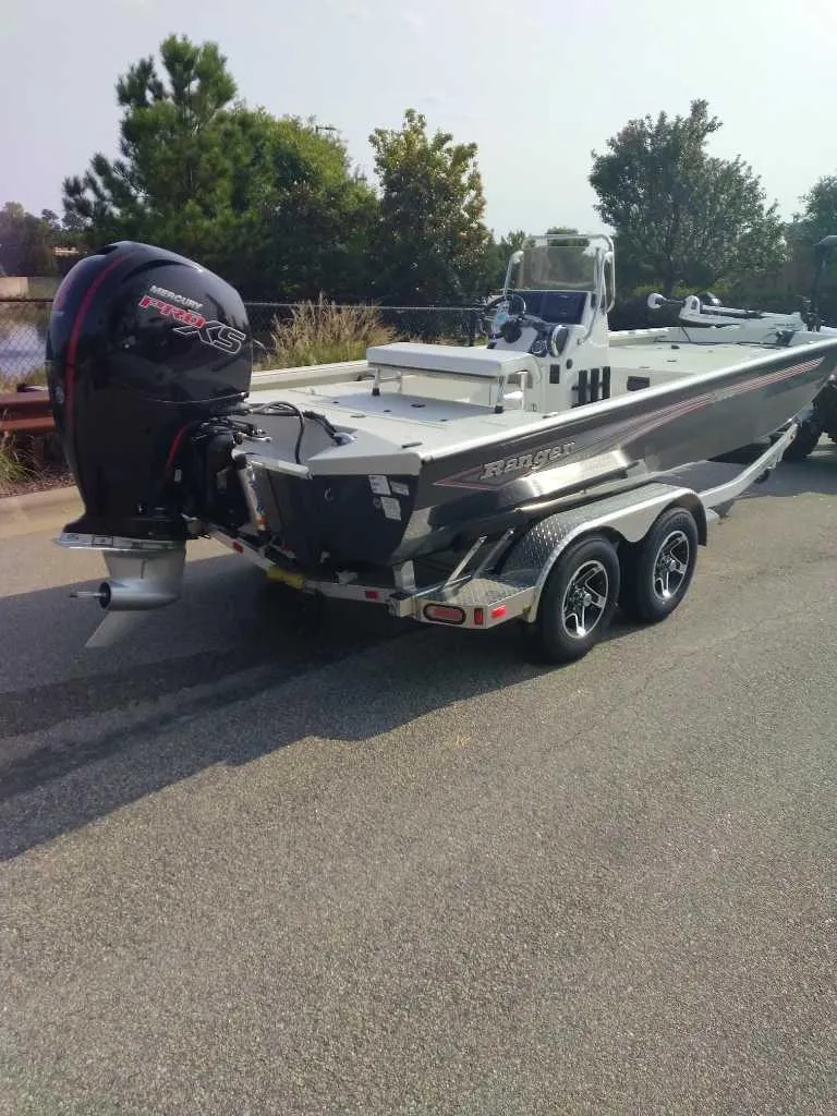 Slide: The Image of 2024 Ranger RB200 boat on trailer with powerful outboard motor. - 4