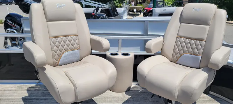 Slide: The Image of 2024 Ranger Reata 223FC boat seats with quilted design and cup holders. - 6