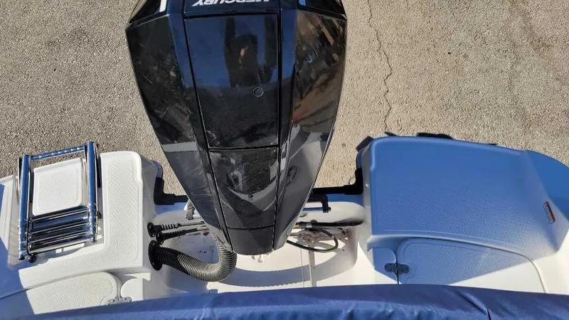 Slide: The Image of 2024 Tahoe 2150 boat with Mercury outboard motor and swim platform. - 6