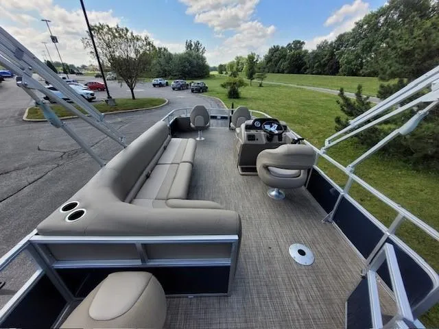 Slide: The Image of 2024 Ranger Reata 200F pontoon boat with spacious seating and modern design. - 4