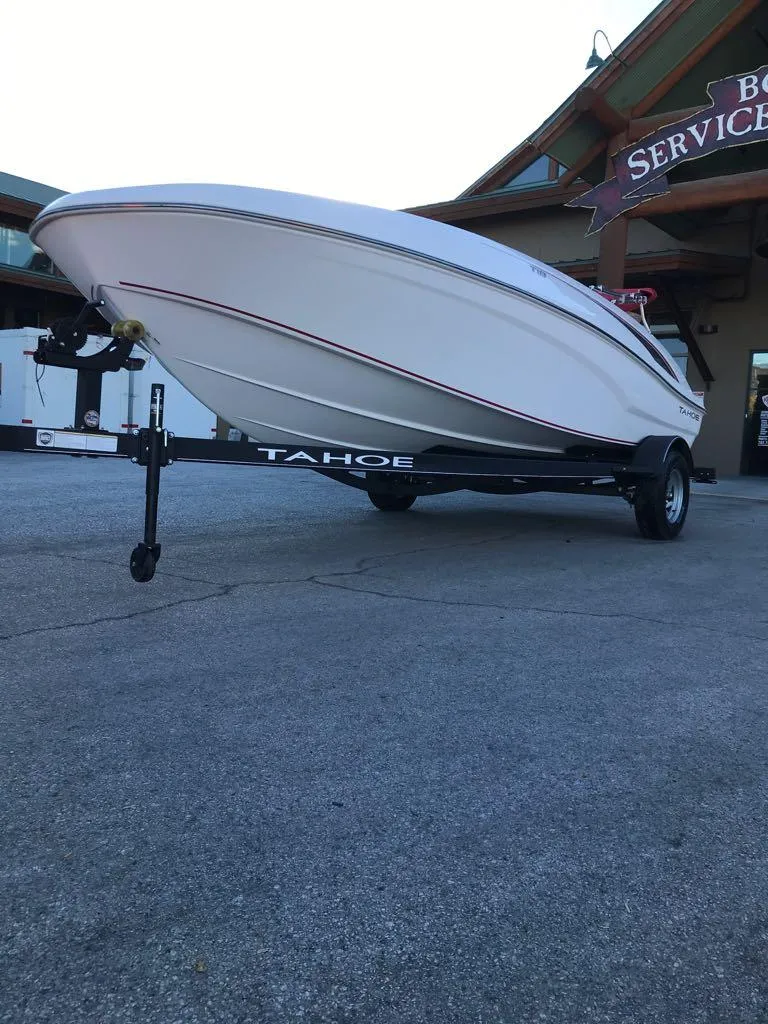 Slide: The Image of 2024 Tahoe T18 boat on trailer outside service center. - 4