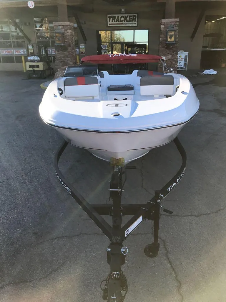 Slide: The Image of 2024 Tahoe T18 boat on trailer outside dealership. - 5