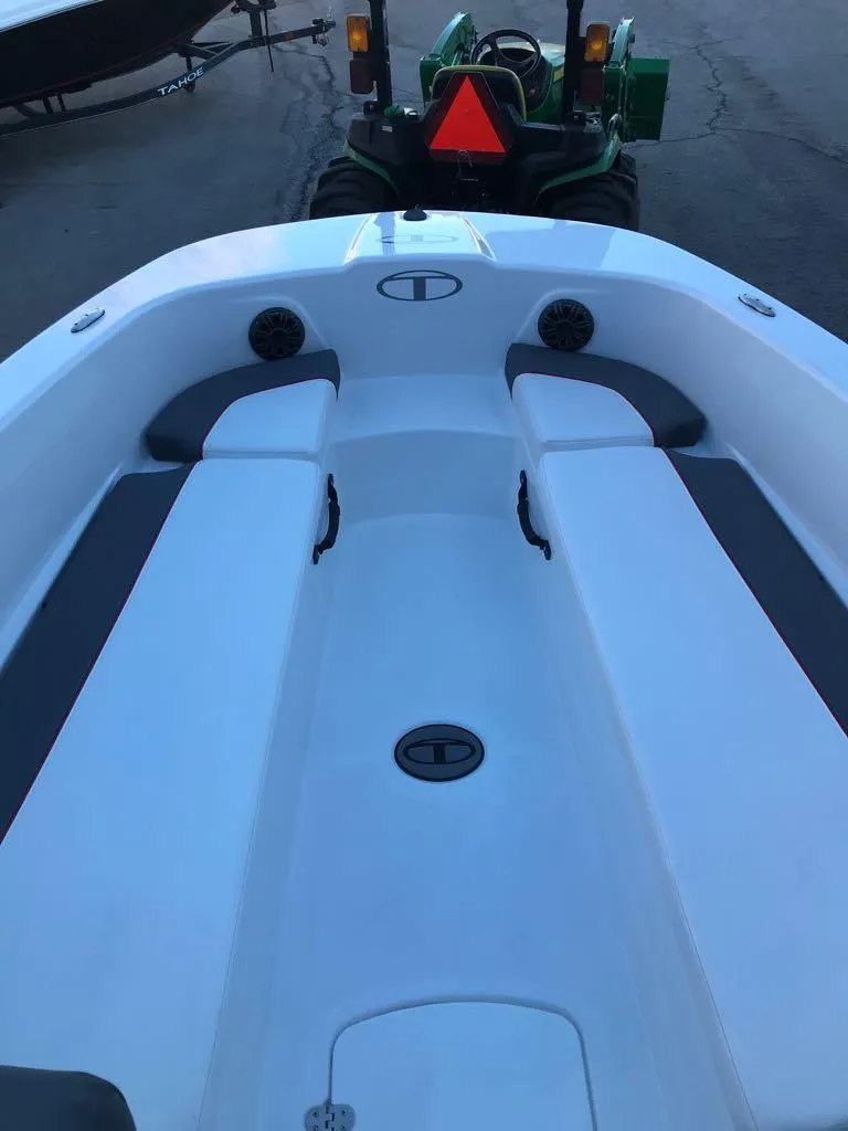 Slide: The Image of 2024 Tahoe T18 boat interior with seating and storage compartments. - 7