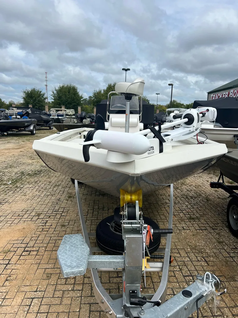 Slide: The Image of 2024 Ranger RB200 boat on trailer, parked outdoors under cloudy sky. - 2