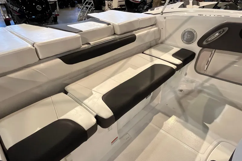 Slide: The Image of 2024 Tahoe 200 S boat interior with cushioned seating and modern design. - 5