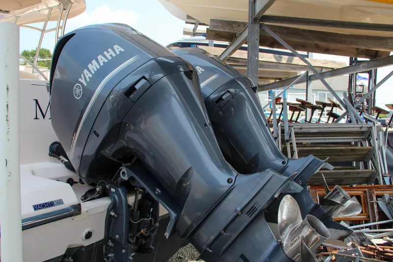 Slide: The Image of Twin Yamaha outboard motors on a 2014 Grady-White Freedom 307 boat. - 10