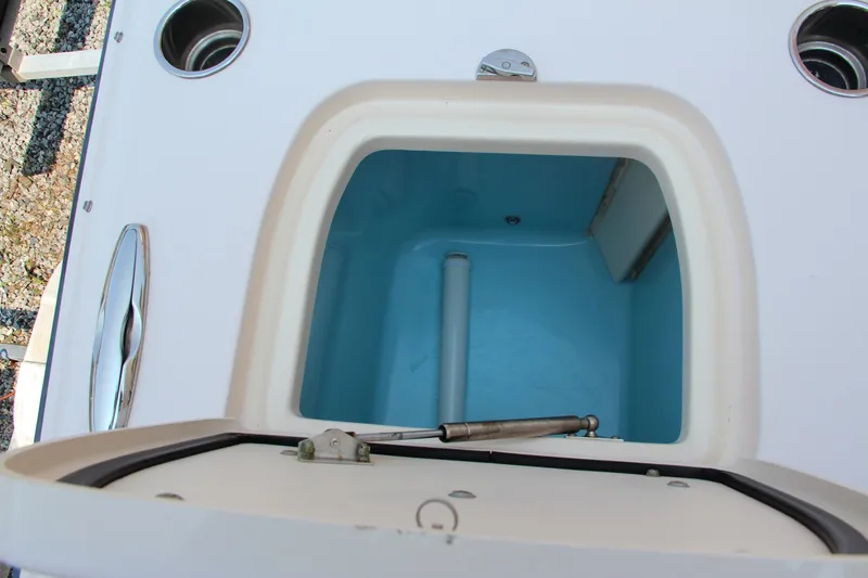 Slide: The Image of Open storage compartment on 2014 Grady-White Freedom 307 boat. - 12