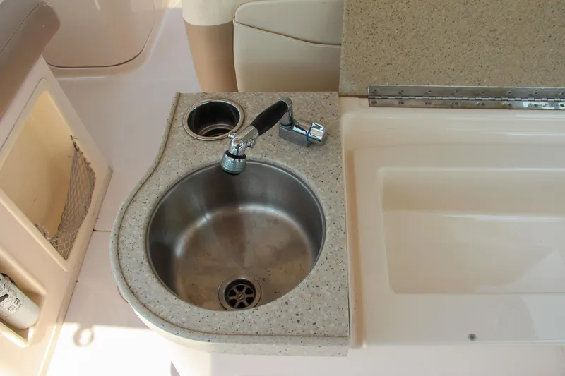 Slide: The Image of 2014 Grady-White Freedom 307 boat sink and countertop detail. - 19