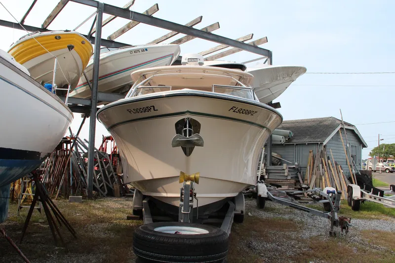 Slide: The Image of 2014 Grady-White Freedom 307 boat on trailer in storage yard. - 2