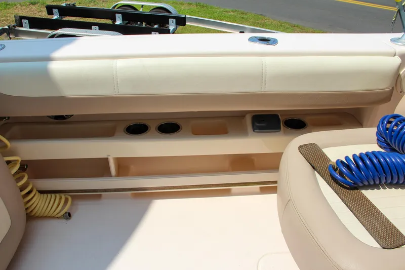 Slide: The Image of 2014 Grady-White Freedom 307 boat interior with seating and storage compartments. - 20