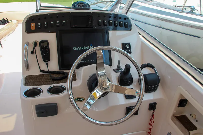 Slide: The Image of Grady-White Freedom 307 2014 boat dashboard with Garmin navigation system. - 28