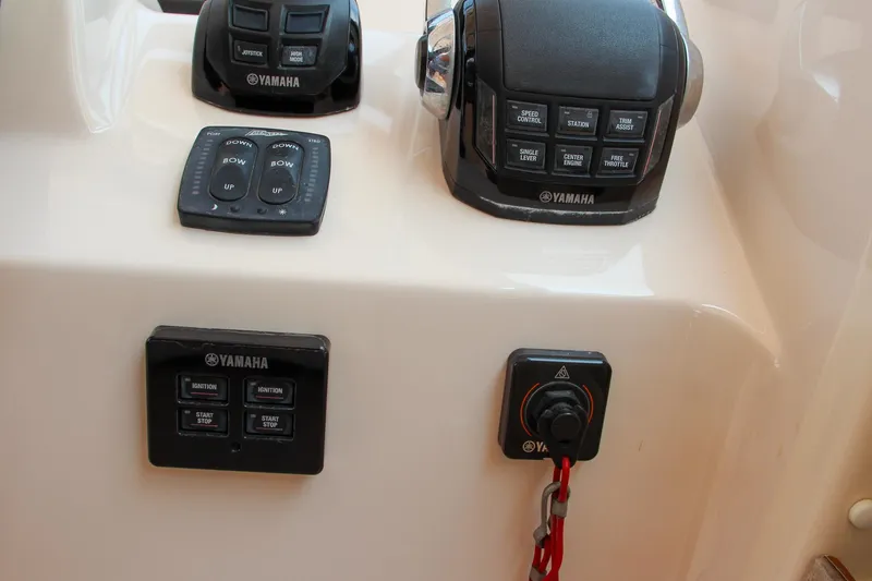 Slide: The Image of Control panel of 2014 Grady-White Freedom 307 boat with Yamaha controls. - 33