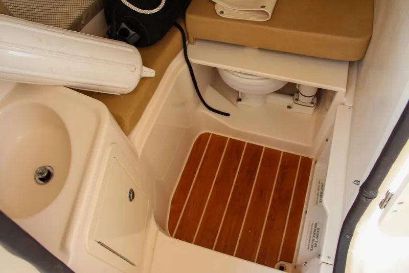 Slide: The Image of 2014 Grady-White Freedom 307 boat interior with sink and toilet. - 44