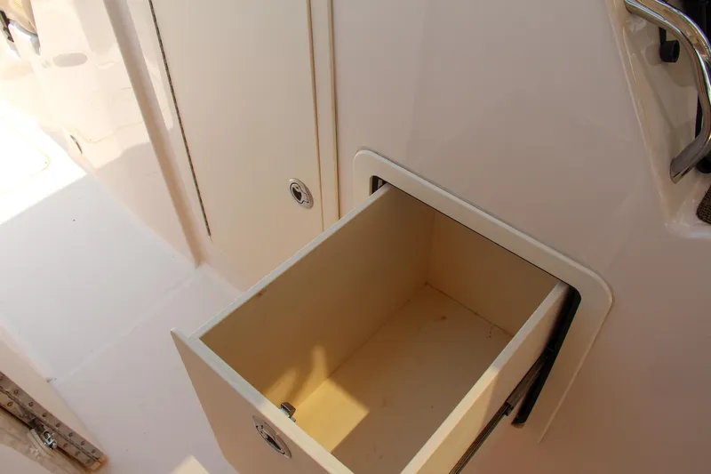 Slide: The Image of Open storage compartment on 2014 Grady-White Freedom 307 boat. - 47