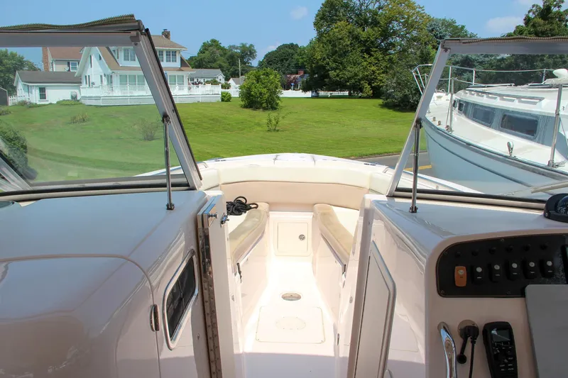 Slide: The Image of 2014 Grady-White Freedom 307 boat interior with open deck and scenic view. - 48