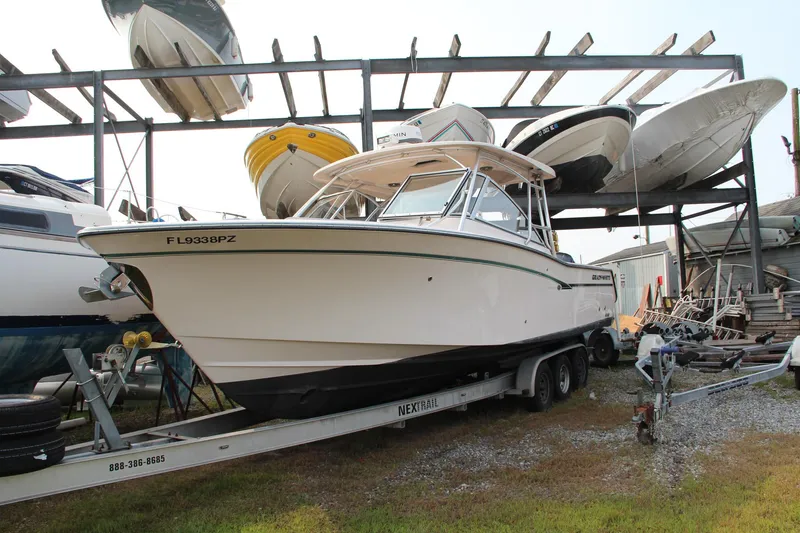 Slide: The Image of 2014 Grady-White Freedom 307 boat on trailer in storage facility. - 5