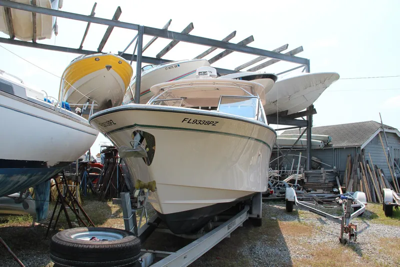 Slide: The Image of 2014 Grady-White Freedom 307 boat on trailer in storage yard. - 8