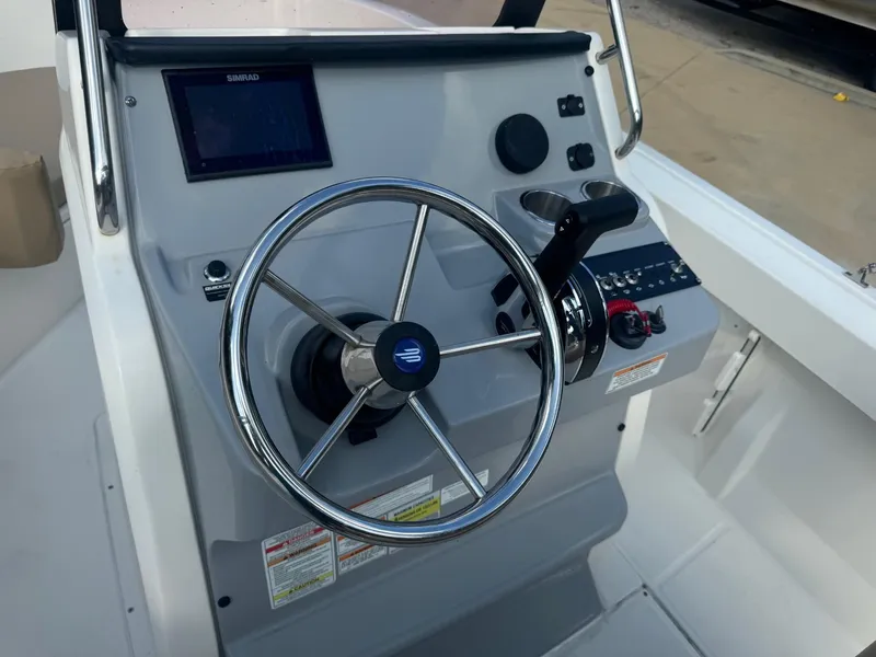Slide: The Image of 2022 Trophy T20 boat steering console with modern controls and navigation display. - 4
