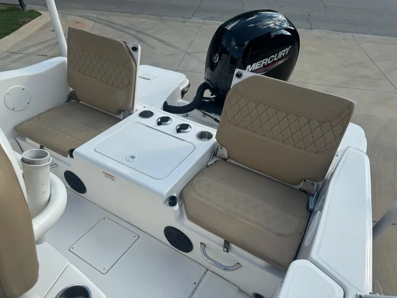 Slide: The Image of 2022 Trophy T20 boat interior with beige seats and Mercury outboard motor. - 7