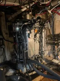 Slide: The Image of Engine room of 1978 Islander Freeport 41 Ketch with visible wiring and components. - 48