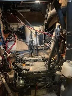 Slide: The Image of Engine room of 1978 Islander Freeport 41 Ketch with visible wiring and components. - 49