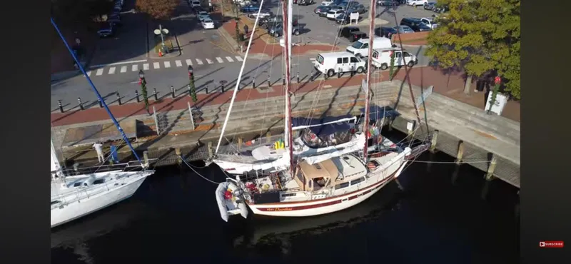 Slide: The Image of Aerial view of 1978 Islander Freeport 41 Ketch docked at a marina. - 5