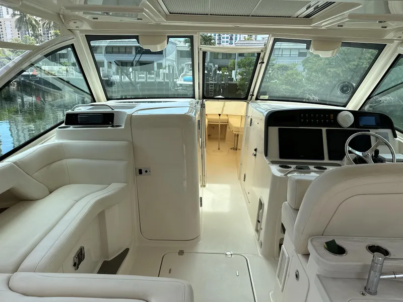 Slide: The Image of Interior of 2017 Grady-White Freedom 375 boat with modern helm and seating. - 12