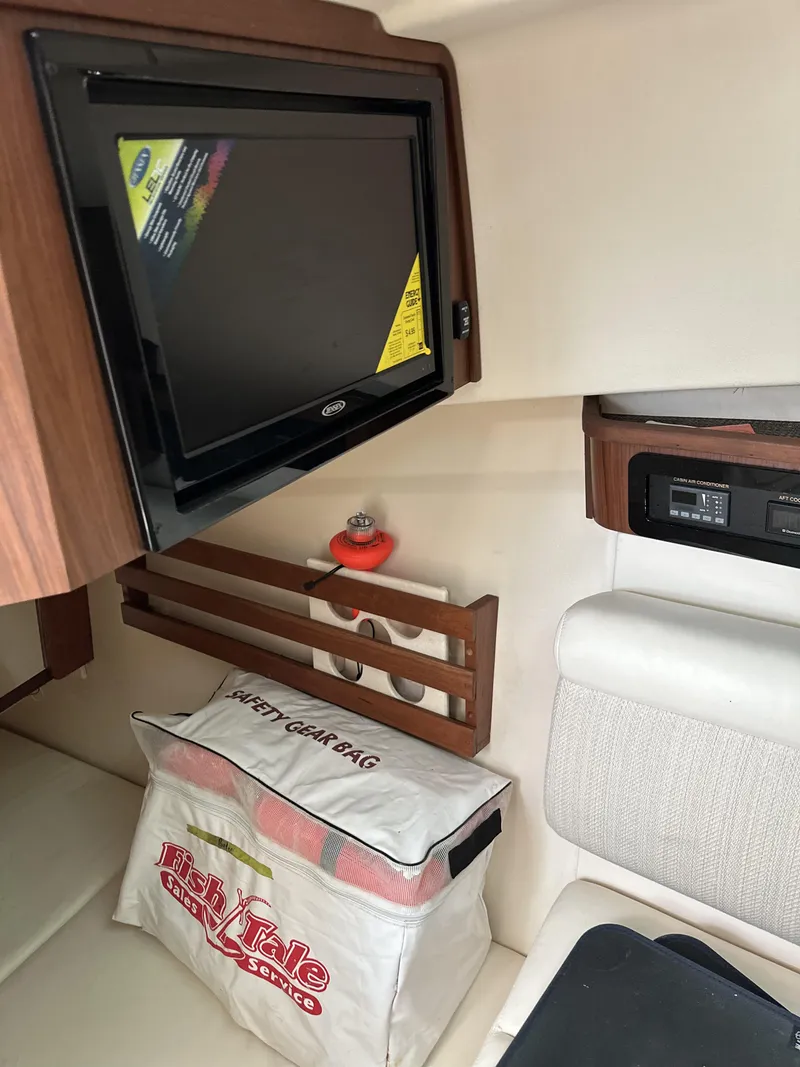 Slide: The Image of Interior of 2017 Grady-White Freedom 375 boat with TV and safety gear bag. - 21