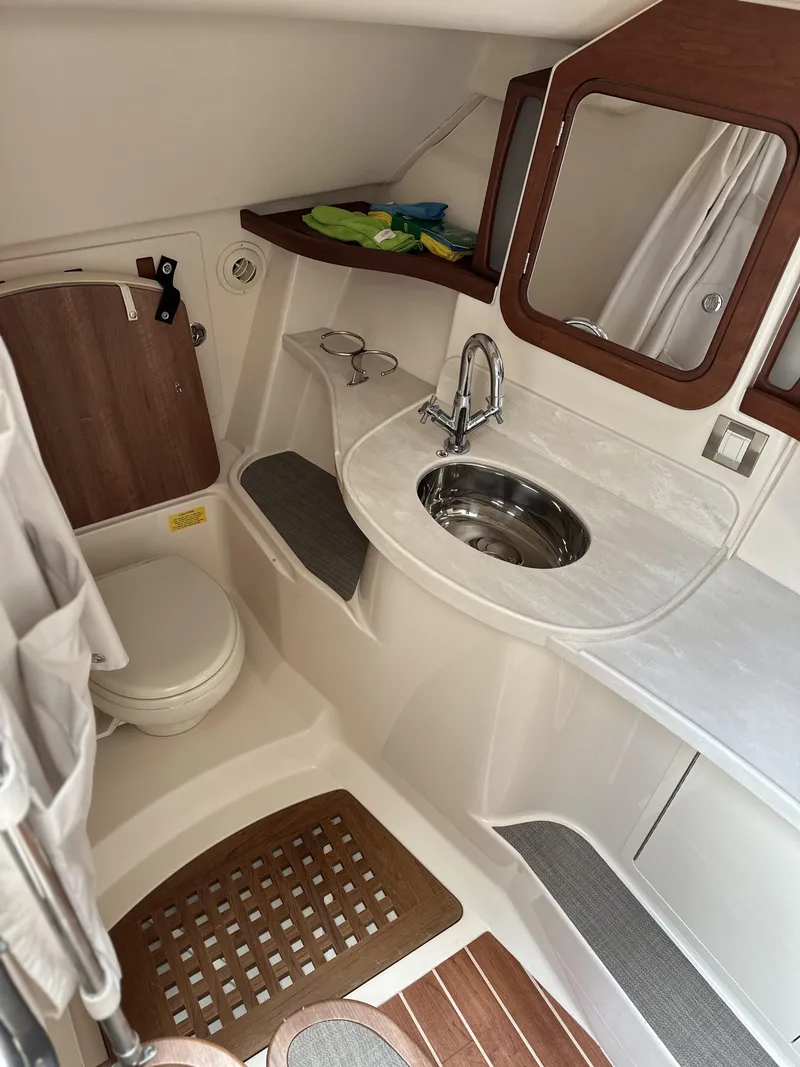 Slide: The Image of 2017 Grady-White Freedom 375 boat bathroom with sink, mirror, and toilet. - 43