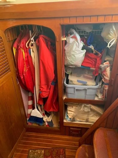 Slide: The Image of Wooden closet on 1988 Slocum 43 yacht, storing clothes and supplies. - 15