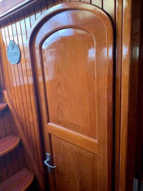 Slide: The Image of Polished wooden door inside 1988 Slocum 43 yacht, showcasing elegant craftsmanship. - 16