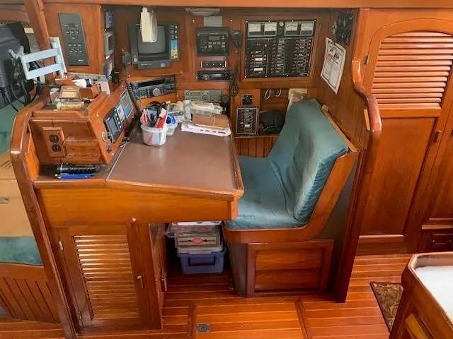Slide: The Image of Navigation station on 1988 Slocum 43 sailboat with wooden interior and equipment. - 19