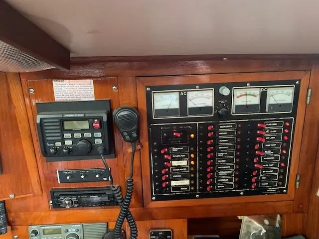 Slide: The Image of Control panel of a 1988 Slocum 43 sailboat with gauges and radio equipment. - 20