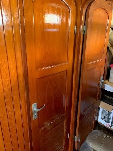 Slide: The Image of Polished wooden interior doors on a 1988 Slocum 43 yacht. - 23