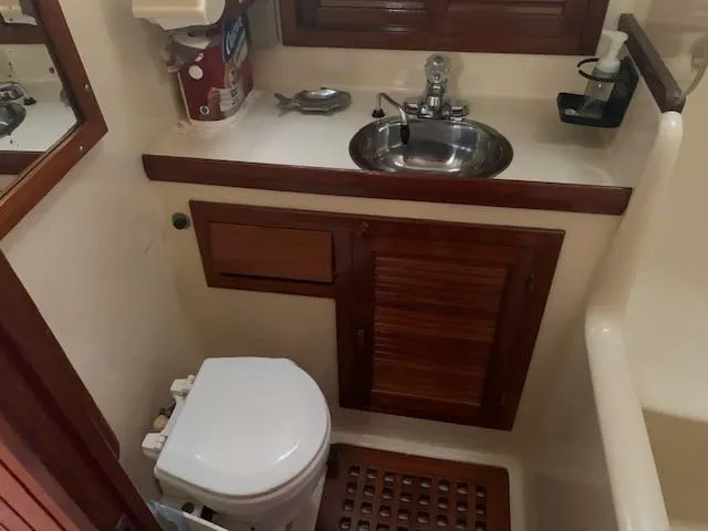 Slide: The Image of Compact bathroom in 1988 Slocum 43 yacht with sink and toilet. - 35