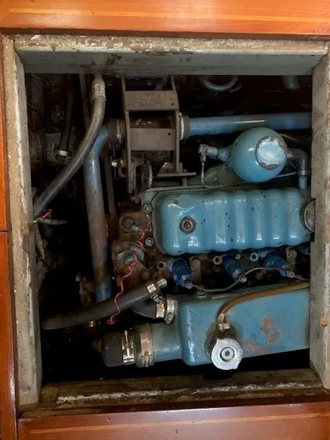 Slide: The Image of Engine compartment of a 1988 Slocum 43 sailboat, showcasing mechanical components. - 37