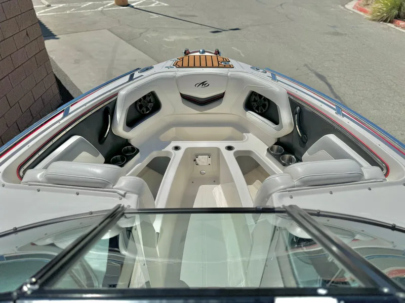 Slide: The Image of 2013 Monterey 214 SS boat interior with seating and speakers. - 10