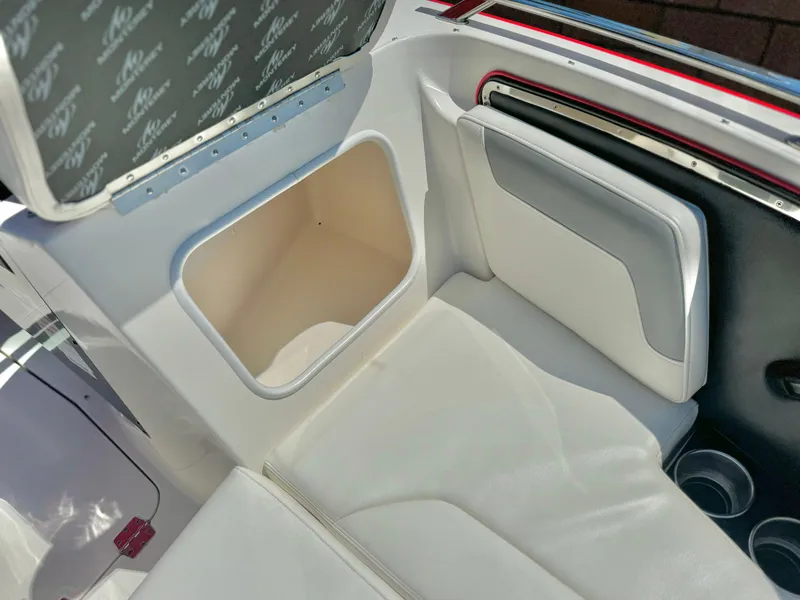 Slide: The Image of Interior of 2013 Monterey 214 SS boat with storage compartment and seating. - 12