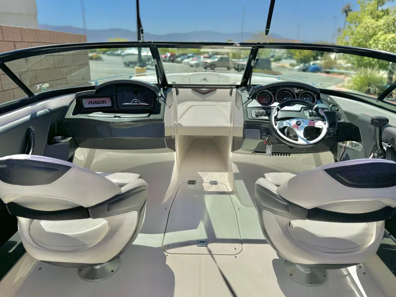 Slide: The Image of Interior of 2013 Monterey 214 SS boat with dual seats and dashboard view. - 14