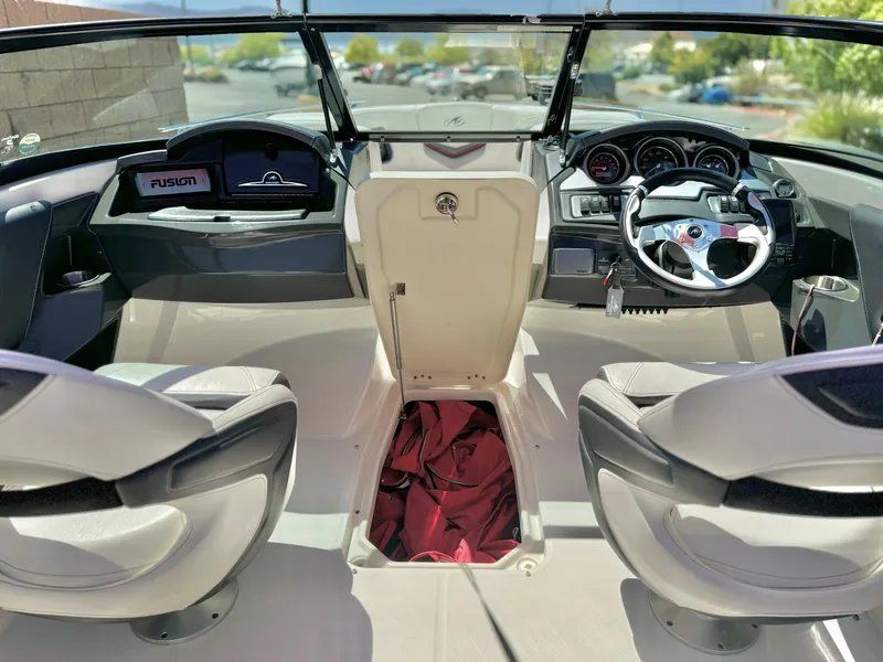 Slide: The Image of Interior of a 2013 Monterey 214 SS boat with modern dashboard and seating. - 15