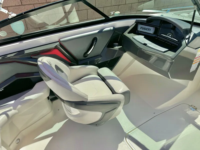 Slide: The Image of Interior of 2013 Monterey 214 SS boat with modern seating and dashboard. - 16