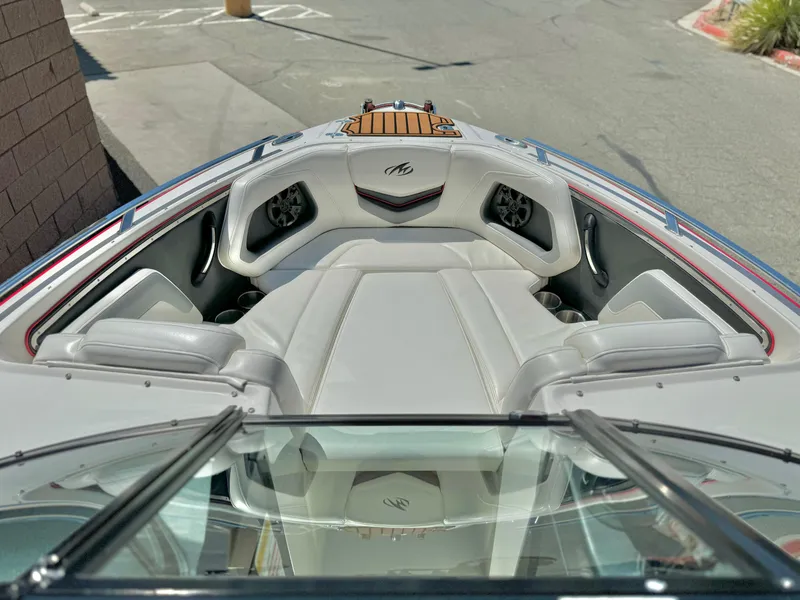 Slide: The Image of 2013 Monterey 214 SS boat interior with plush seating and sleek design. - 9