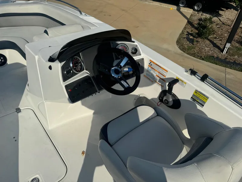 Slide: The Image of 2022 Hurricane SS 192RL boat cockpit with steering wheel and controls. - 3