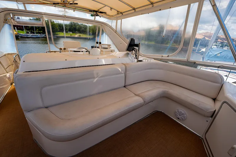 Slide: The Image of Luxurious seating area on 1995 Sea Ray 550 Sedan Bridge yacht. - 16
