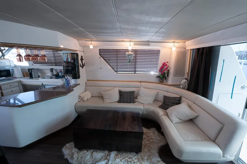Slide: The Image of Luxurious interior of 1995 Sea Ray 550 Sedan Bridge yacht with modern furnishings. - 23